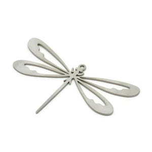 May include: A silver-coloured dragonfly pendant with openwork wings and a slender body. The dragonfly is a decorative item, possibly for jewellery or crafts, and is set against a white background.