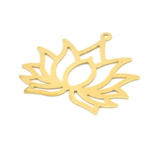 May include: Gold-toned metal charm in the shape of a lotus flower. The charm has a cutout design and a hole at the top for attaching to jewelry.