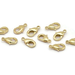 Peut inclure: Dix fermoirs &agrave; ressort dor&eacute;s, un type de fermoir utilis&eacute; pour la fabrication de bijoux.