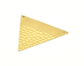 May include: A gold triangle pendant with a hammered texture on one side and a smooth surface on the other. The pendant has two holes for attaching a chain or cord.