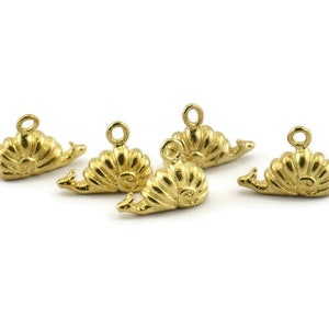 May include: Five gold-coloured snail charms with a loop at the top for attaching to jewellery or other crafts.