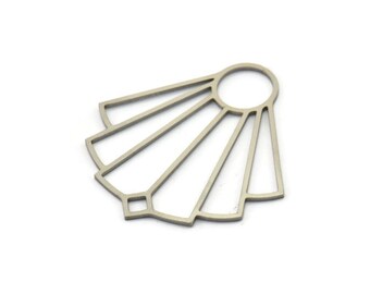May include: A silver metal sunburst design with a circular opening in the center. The design is made of thin metal and has a geometric pattern.