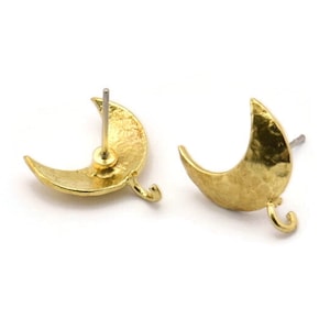 May include: A pair of gold crescent moon earring findings with a hammered texture. The findings have a loop on the bottom for attaching a dangle charm.