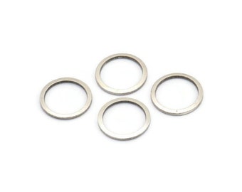 May include: Four silver metal washers, each with a circular shape and a smooth surface.