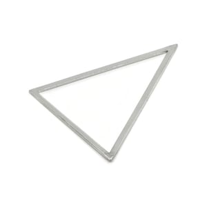 May include: A silver-coloured, triangular frame with a hollow centre. The frame is made of a thin, metallic material and is set against a white background. The shape is a geometric design.