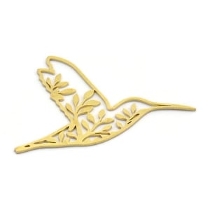 May include: A gold-colored metal hummingbird cutout with a delicate floral design. The hummingbird is in flight with its wings spread out.