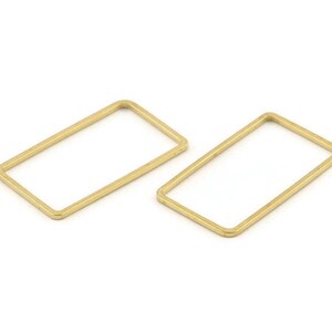 May include: Two gold-colored metal rectangle-shaped hoops. The hoops are open and ready to be used for jewelry making.