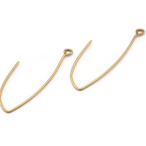 May include: Two gold-colored earring wires with a loop at the top. The wires are bent into a V-shape.