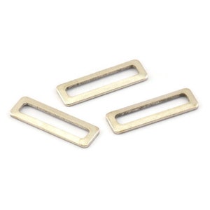 May include: Three silver metal rectangular loop connectors with a smooth finish.