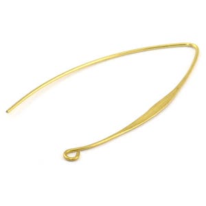 May include: Gold-toned earring finding with a curved shape and a small loop at the bottom.