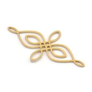 May include: A gold-coloured metal charm featuring a delicate, intricate design resembling a stylised flower or leaf. The charm has a symmetrical shape with multiple overlapping loops and curves.