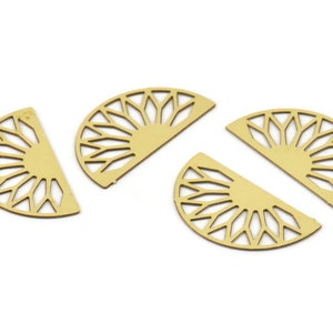 May include: Four gold-colored metal decorative pieces shaped like half circles with a geometric design.