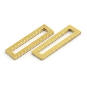 May include: Two gold-coloured metal rectangular jump rings with a rectangular opening in the centre.