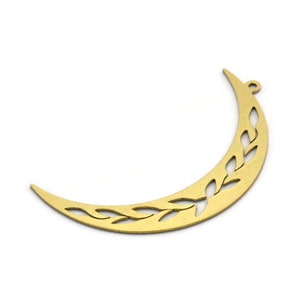 May include: Gold crescent moon charm with a cut-out design of leaves. The charm has a hole at the top for attaching to jewelry.