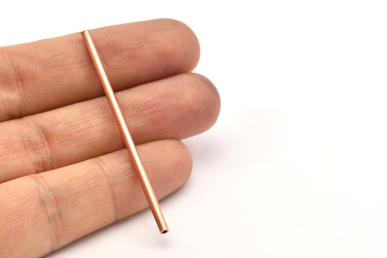 May include: A long, thin, copper tube.