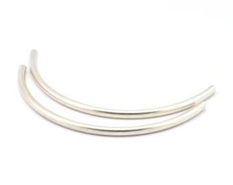 May include: Two silver metal hoops, each bent into a semi-circle shape.