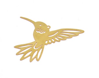 May include: A gold metal hummingbird cutout with intricate details in the wings and body.