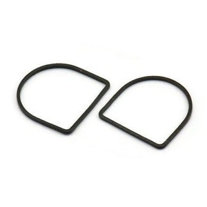 May include: Two black, semi-circular rubber gaskets. Each gasket has a flat base and rounded top, with a thin, rectangular profile. The gaskets are set against a white background.