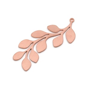 May include: A copper-coloured metal leaf charm featuring a branch and oval leaves. The charm has a small loop at the top for attaching to jewellery. The design is simple and elegant, suitable for various craft projects.