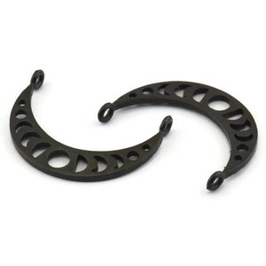 May include: Two black metal crescent moon charms with a cut-out design of different moon phases.