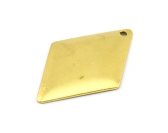 May include: A gold-coloured diamond-shaped pendant with a hole at the top for attaching a chain or cord.