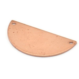 May include: A copper half-circle pendant with two holes for attaching a chain or cord. The pendant has a hammered texture and a smooth, polished finish.