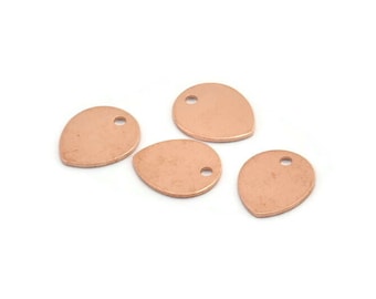May include: Four rose gold-colored metal teardrop-shaped charms with a hole in the center.