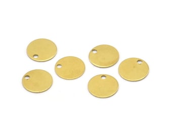 May include: Six gold-colored metal round disc charms with a small hole in the center of each disc.
