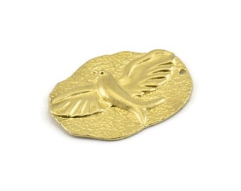 May include: Gold-toned metal charm featuring a stylized dove in flight, with a textured background.