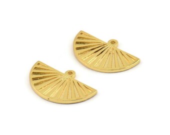 May include: Two gold-colored, fan-shaped charms with a textured, ridged design. Each charm has a small loop at the top for attaching to jewelry. The charms are set against a white background.
