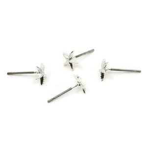 May include: Four silver star-shaped stud earrings with a post and butterfly backing.