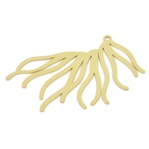 May include: Gold-toned metal pendant with a fan-shaped design featuring multiple curved lines.