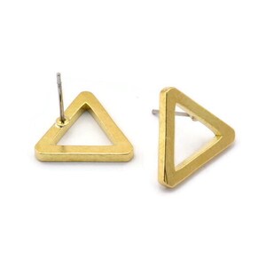 May include: Two gold-colored triangle stud earrings. Each earring has a hollow triangle shape with a post for piercing. The earrings are displayed on a white background.