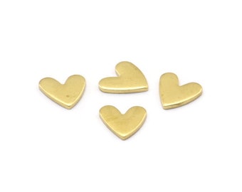 May include: Four small gold heart-shaped charms.