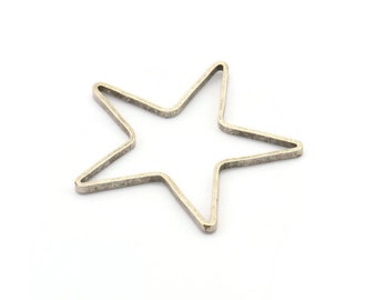 May include: A silver-toned metal star-shaped charm with a smooth, slightly textured surface.
