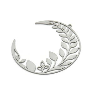 May include: A silver metal crescent moon with a delicate floral design cut out. The moon is a decorative wall hanging.