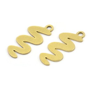 May include: Two brass-colored metal charms in a wavy, serpentine shape. Each charm has a small loop at the top for attaching to jewelry or other crafts. The charms are on a white background.