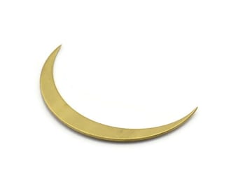 May include: A gold crescent moon shape, a decorative metal accent.