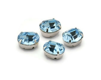 10 topazes bleues en cristal de Swarovski, monture griffes en argent 10 x 8 mm