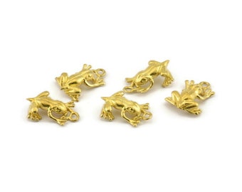 May include: Five gold-colored frog charms with a loop for attaching to jewelry or other crafts.