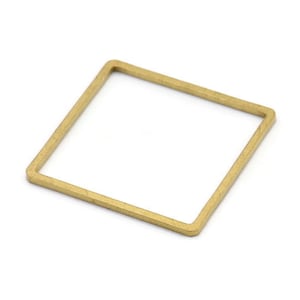 Könnte beinhalten: Ein goldener quadratischer Ring mit glatter, polierter Oberfläche.