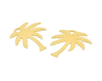May include: Two gold-colored metal palm tree charms. The palm trees are cut out and have a detailed design.