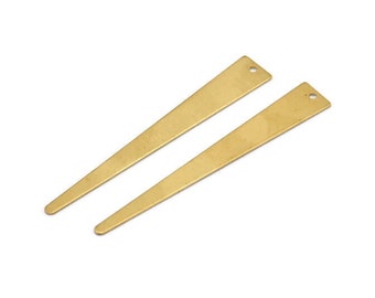May include: Two gold-colored metal triangle-shaped earring blanks with a hole at the top.
