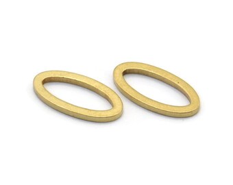 May include: Two gold oval-shaped metal rings. The rings are smooth and have a shiny finish.