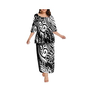 May include: A black and white patterned dress with a short-sleeved top and a long skirt. The pattern is a traditional Polynesian design.