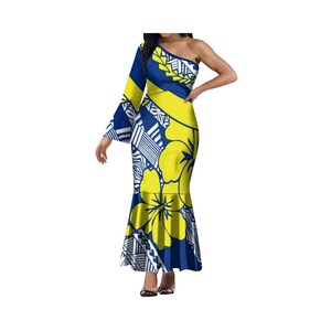 May include: A blue and yellow maxi dress with a one-shoulder design and a floral print. The dress has a long sleeve on one side and a bell sleeve on the other. The dress has a fitted bodice and a flowing skirt.