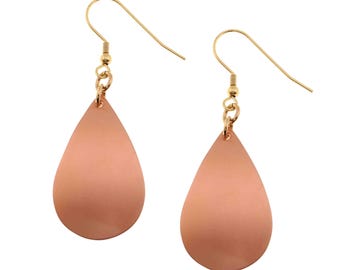 May include: A pair of gold teardrop earrings with a smooth, peach-colored finish.