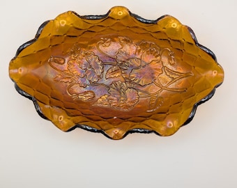 Vintage Imperial Glass Company Marigold Carnival Glass pickle or relish dish in the "Pansy" pattern.