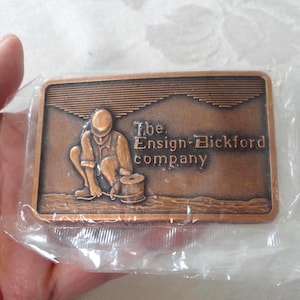 SEALED Vintage The Ensign Bickford Company Belt Buckle Copper Tone Metal Made in USA Mining Blasting Products UNWORN Estate Find