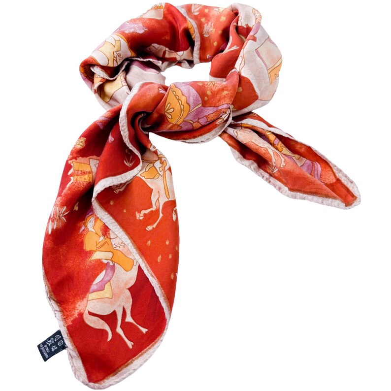 May include: A square silk scarf featuring a vibrant red background with a repeating pattern of stylized figures riding horses in shades of orange, yellow, and light purple. The scarf has a light-colored rolled hem and a small black care label attached.